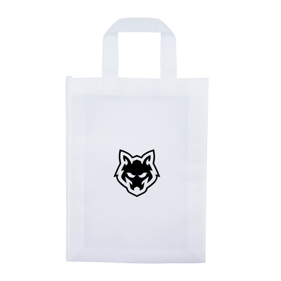 A black tote bag with two handles, featuring a logo on one side, held by a person.