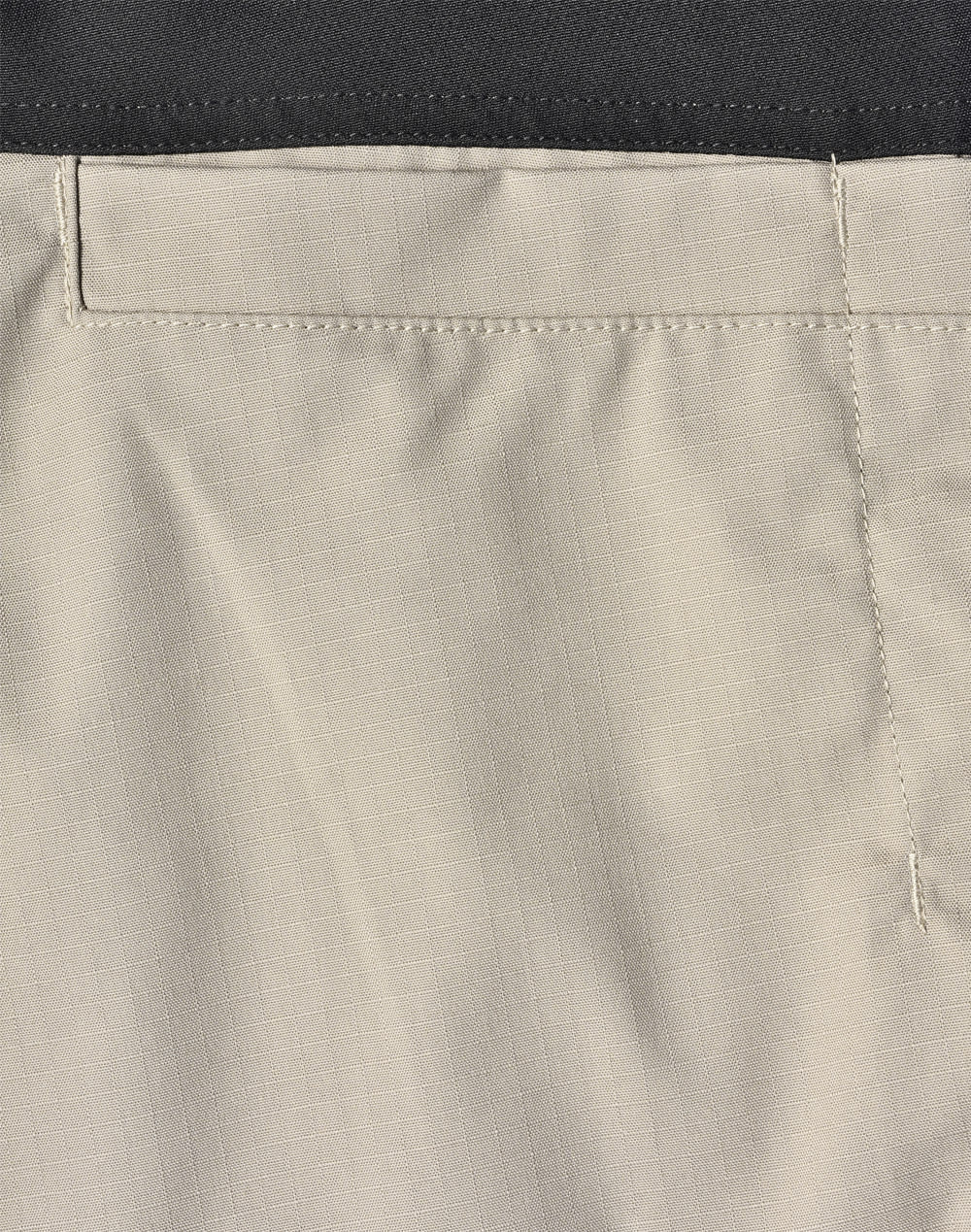 Rip-stop poly/cotton stretch work pants in a light beige colour with a black waistband and stitching details.