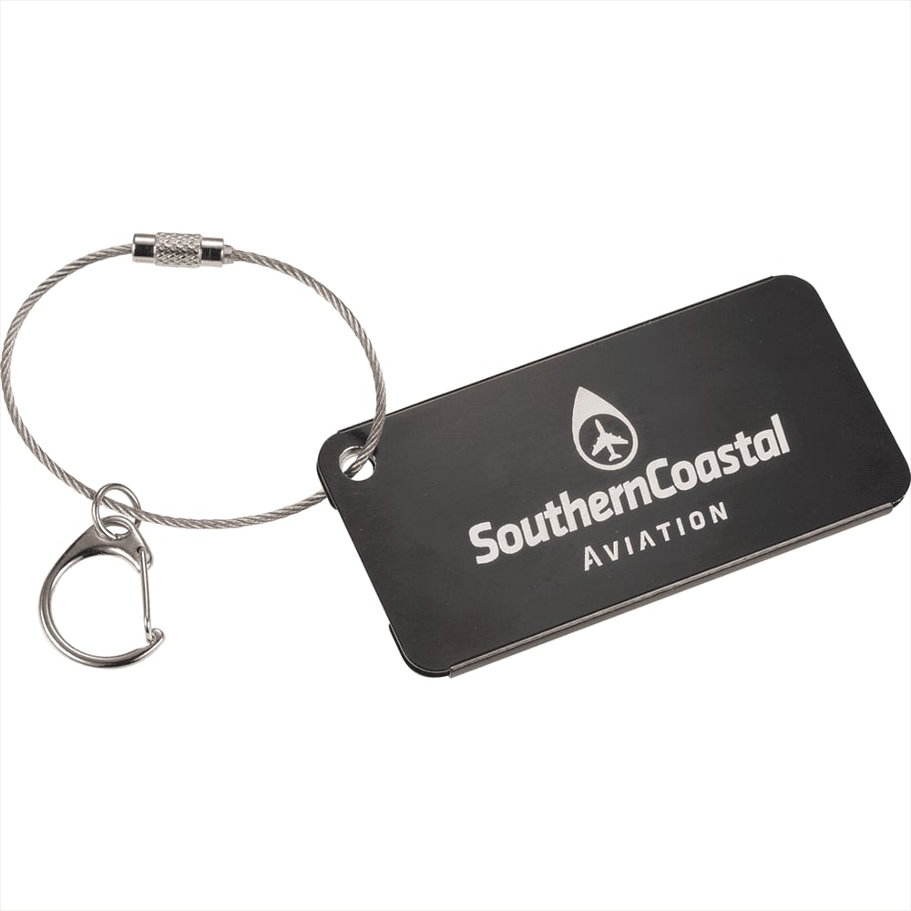 A black aluminium identification tag with a metal loop for attachment and a logo.