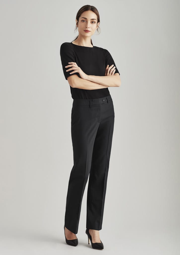 A pair of black women's relaxed stretch pants, styled with a fitted top and heels, featuring a subtle logo.