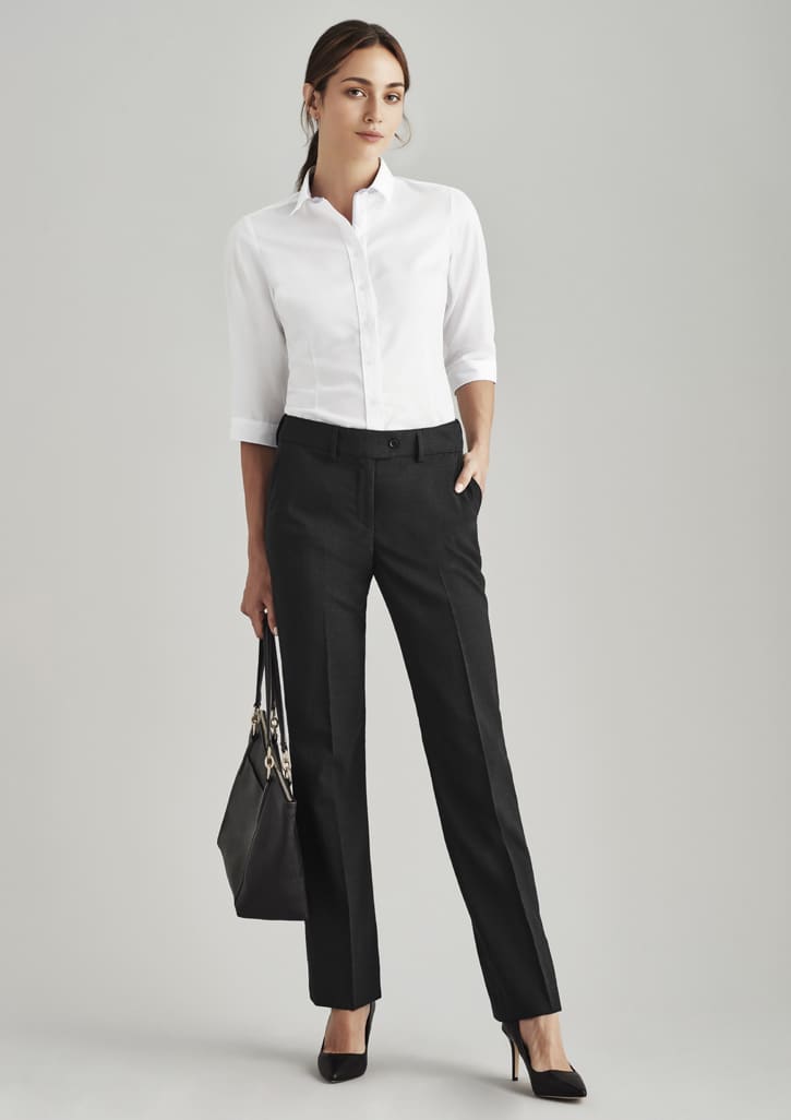 Women's black stretch pants with adjustable waist, paired with a white shirt and black handbag for a polished look.