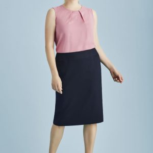 A lined skirt in navy paired with a pink top, featuring a relaxed fit and a subtle pleat detail.
