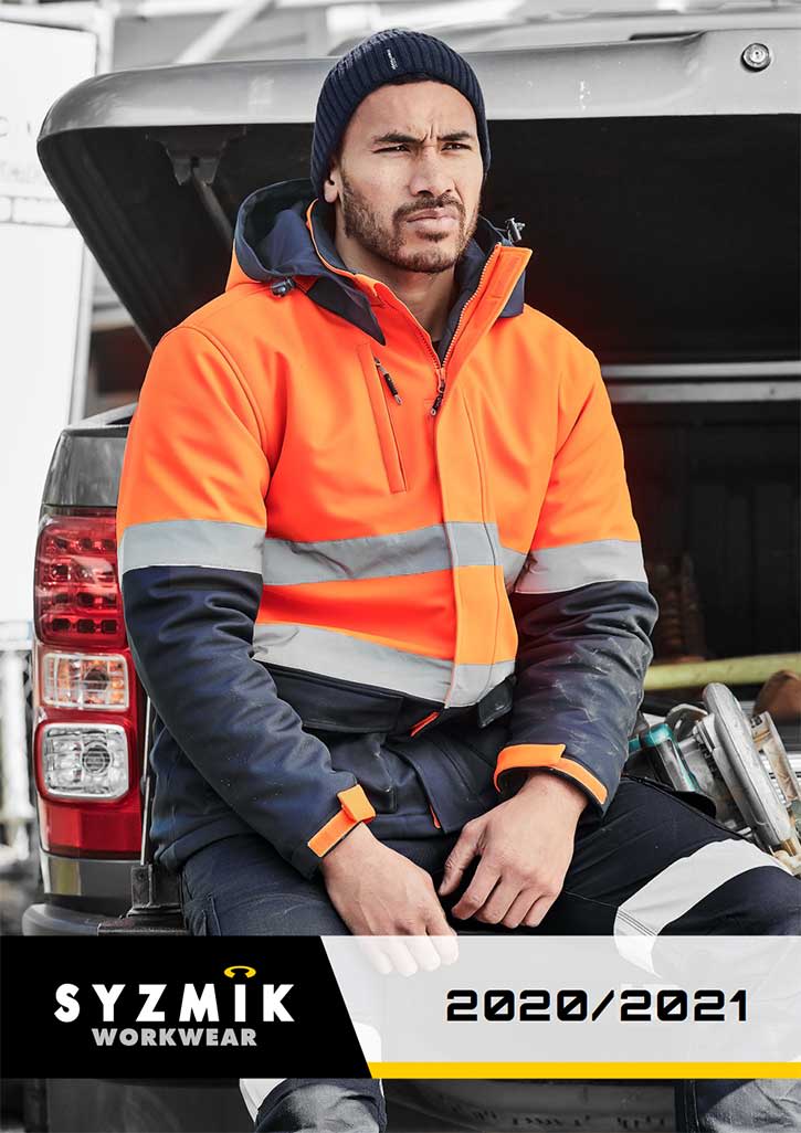 A man in a high-visibility orange jacket sits near a vehicle, wearing a beanie and dark pants. The image includes a logo.