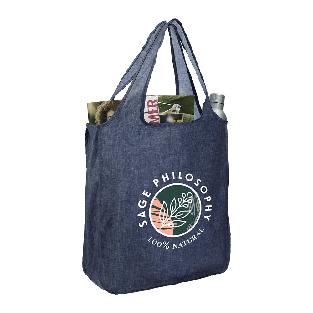 A recycled large shopper tote in dark blue with a logo, holding magazines and a drink bottle.