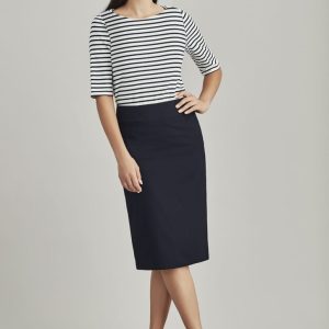 A relaxed fit lined skirt in navy, styled with a striped top and heels. The model stands against a neutral background.