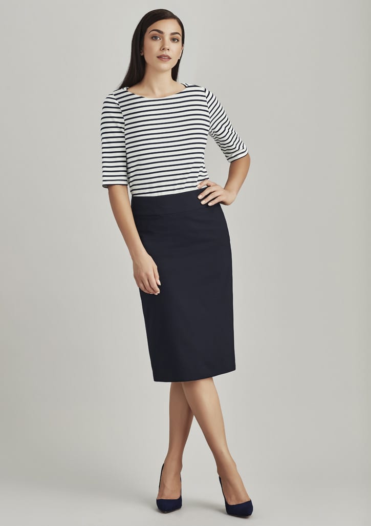 A relaxed fit lined skirt in navy, styled with a striped top and heels. The model stands against a neutral background.