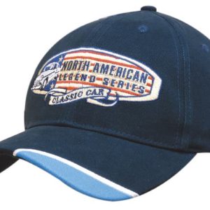 A navy blue cap with piped peak indents and a logo featuring classic car themes.