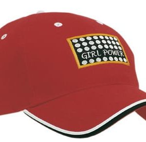 A red cap with double peak trim features a logo and contrasting accents, showcasing a sporty design.