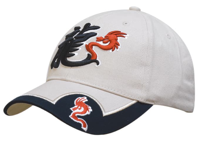 A beige cap with a navy peak insert and embroidered dragon designs, featuring a logo on the front.