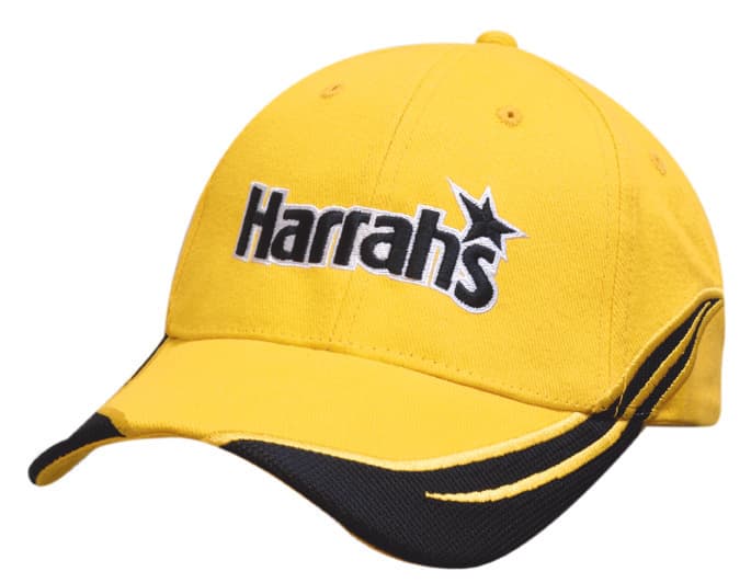 A yellow cap with black accents and an embroidered logo. It features a peak and crown inserts.