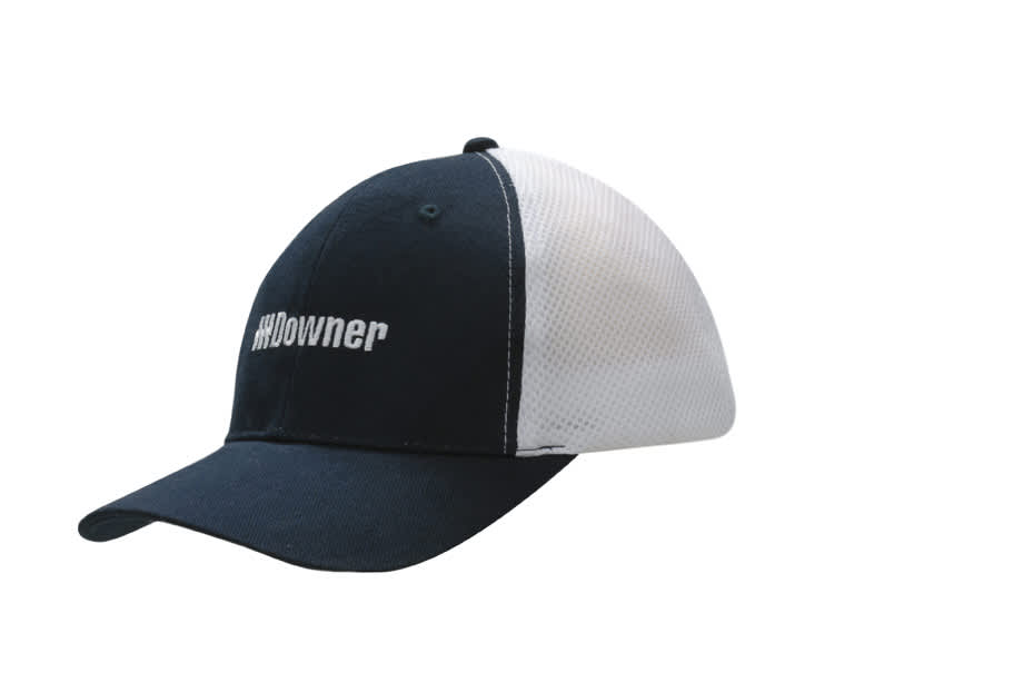 A navy and white cap featuring a mesh back and a logo on the front.