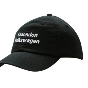 A black washed chino twill cap featuring a logo on the front and an adjustable strap at the back.