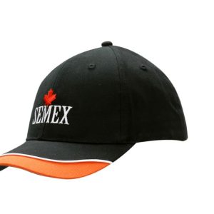 A black cap with orange trim and piping on the peak, featuring a logo on the front.