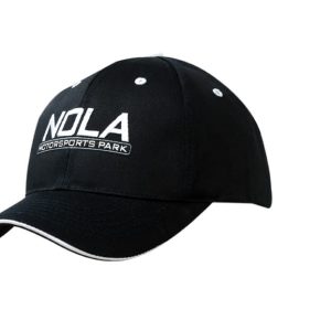A black cap with a curved peak and fabric inserts on the crown, featuring a logo.