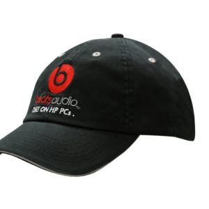 A black chino twill cap with sandwich trim and a back strap stripe, featuring a logo.