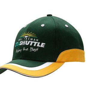 A green and gold cap made of cotton twill, featuring a logo and trim on the crown and peak.