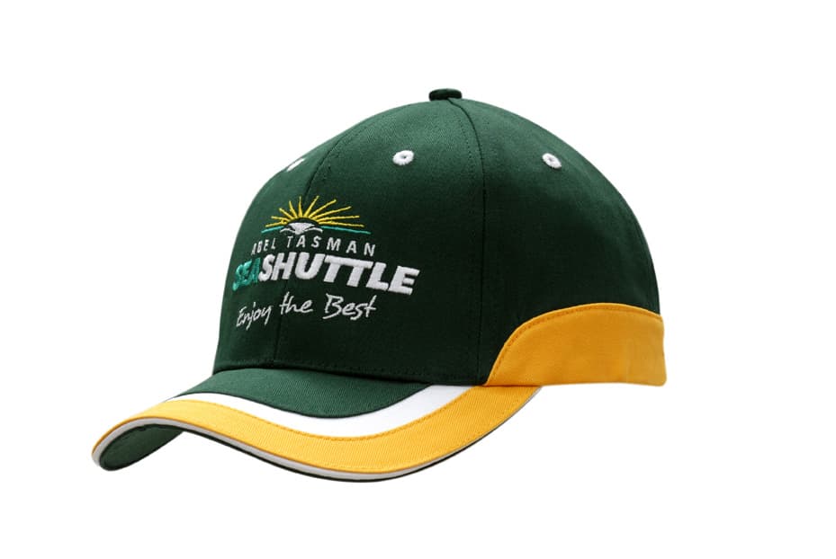A green and gold cap made of cotton twill, featuring a logo and trim on the crown and peak.