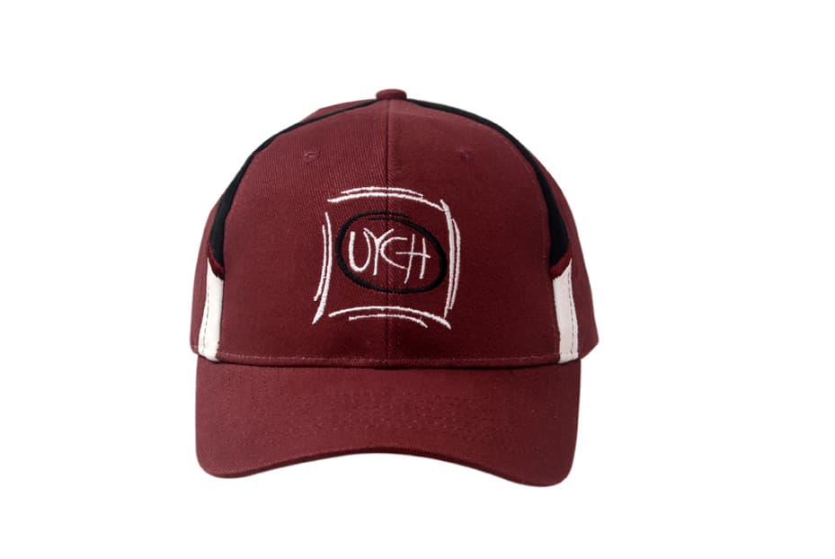 A maroon cap with black fabric inserts on the crown and a logo on the front.