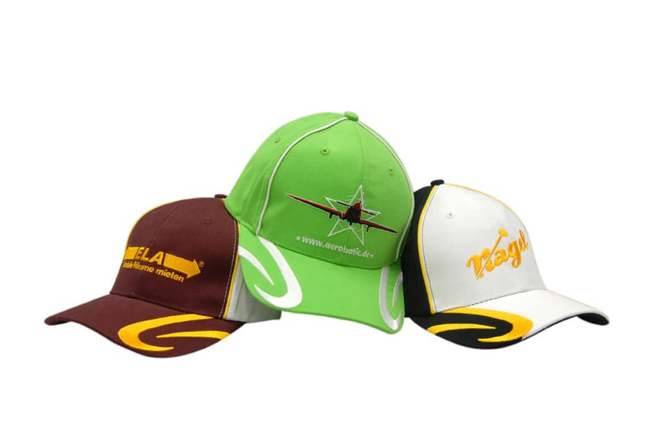 Three caps featuring a green cap with embroidery, a brown cap with a logo, and a white cap with yellow accents.