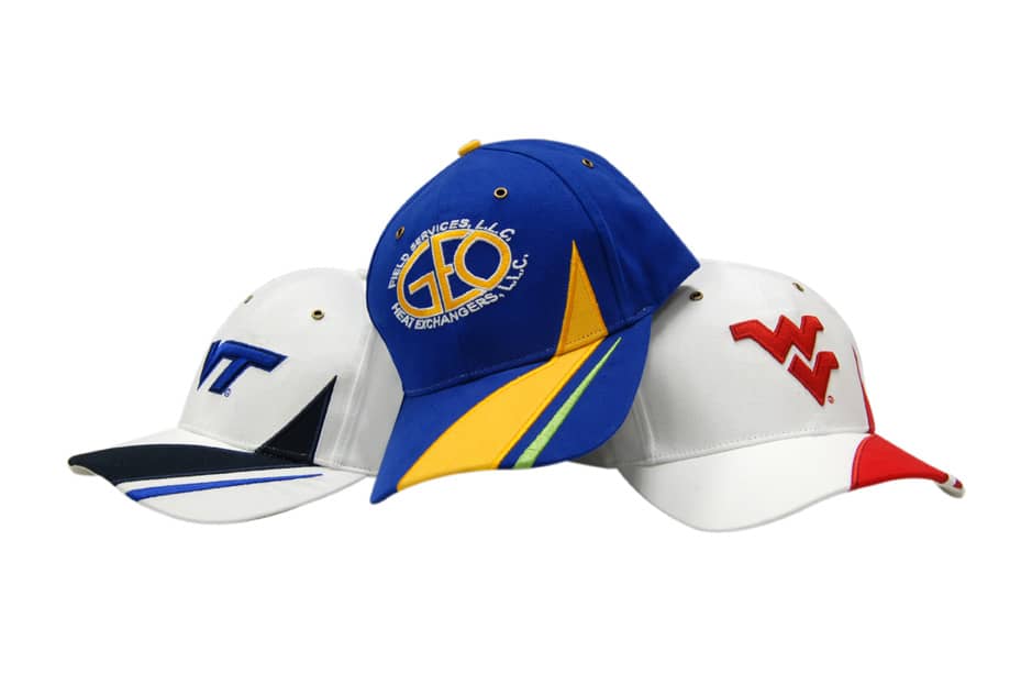 Three caps in various designs: one blue with a logo, one white with a stripe, and another white with a red accent.