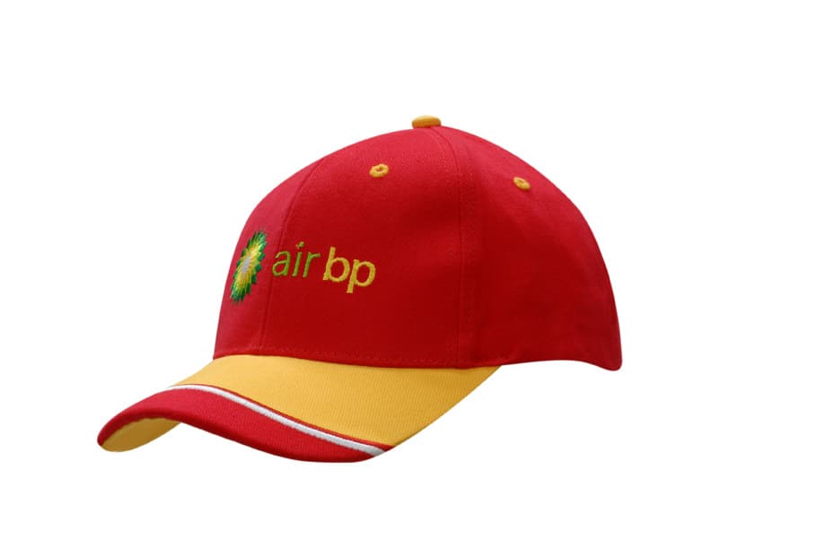 A red and yellow cap featuring an embroidered logo on the front and a fabric insert on the peak.