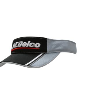 A grey and black visor featuring fabric inserts and embroidery on the peak, accompanied by a logo.
