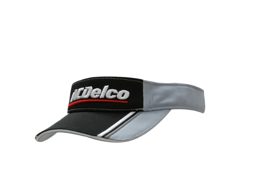 A grey and black visor featuring fabric inserts and embroidery on the peak, accompanied by a logo.