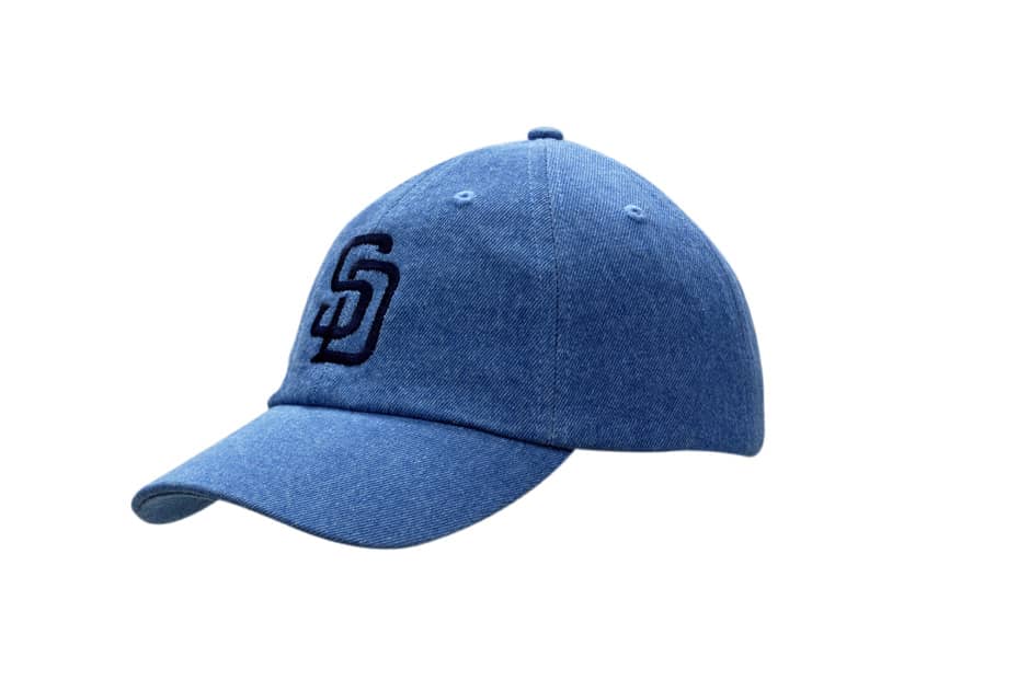 Washed denim cap in blue featuring a logo on the front. Designed for casual wear.
