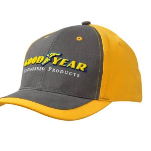 A grey and yellow Brushed Heavy Cotton Cap with a peak indent, featuring a logo on the front.