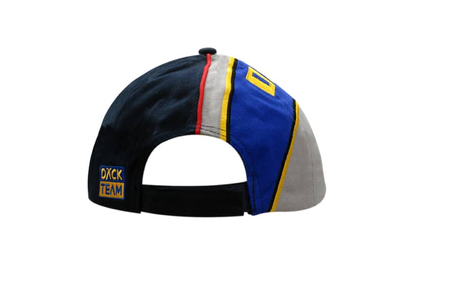 A multi-coloured cap featuring embroidered lines and a logo, designed with a sandwich trim and fabric inserts.
