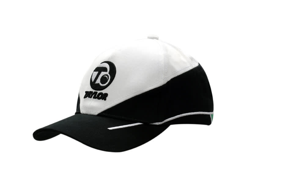 A black and white cotton cap with crown inserts and embroidered lines, featuring a logo on the front.
