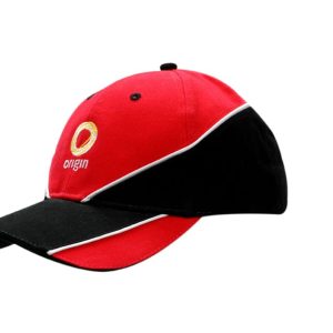 A red and black cap featuring fabric inserts and piping, with a logo on the front.