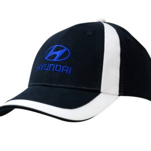 A black and white cap featuring fabric inserts on the crown and peak, with a logo on the front.
