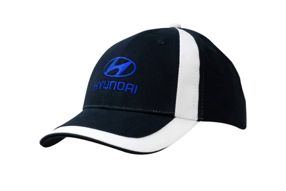 A black and white cap featuring fabric inserts on the crown and peak, with a logo on the front.