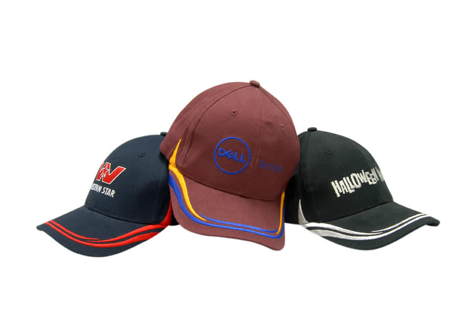A collection of three caps featuring embroidery, in shades of burgundy, navy, and black. One cap has a logo.