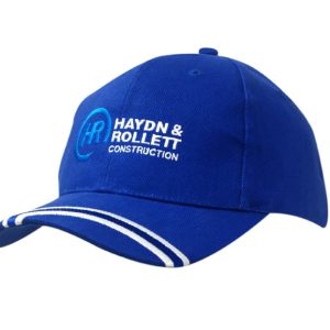 A blue brushed heavy cotton cap with an embroidered logo on the peak and white striped detailing.