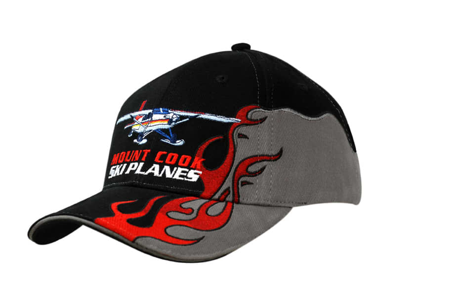 A black and grey cap featuring flame embroidery on the peak and a plane graphic on the crown.