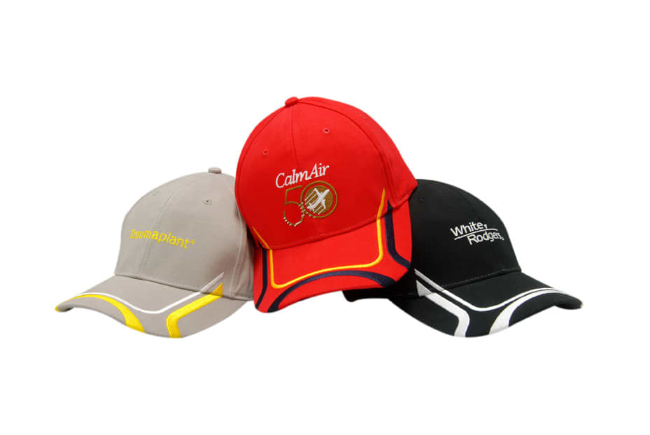 Three caps in grey, red, and black, featuring embroidered designs and logos on the front panels.
