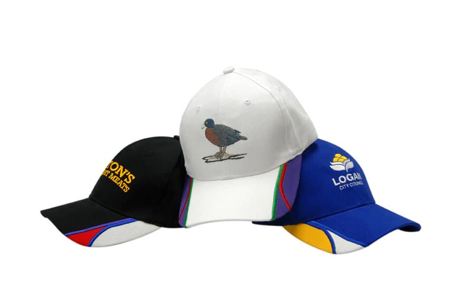 A collection of caps in black, white, and blue, featuring a bird embroidery and various accent colours.