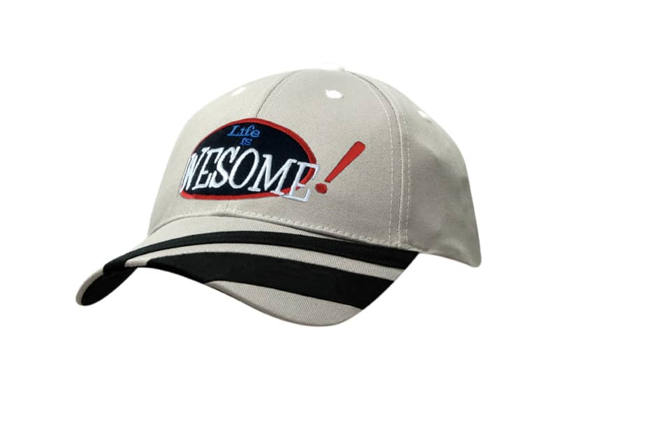 A beige cap featuring peak fabric stripes and a logo with text.