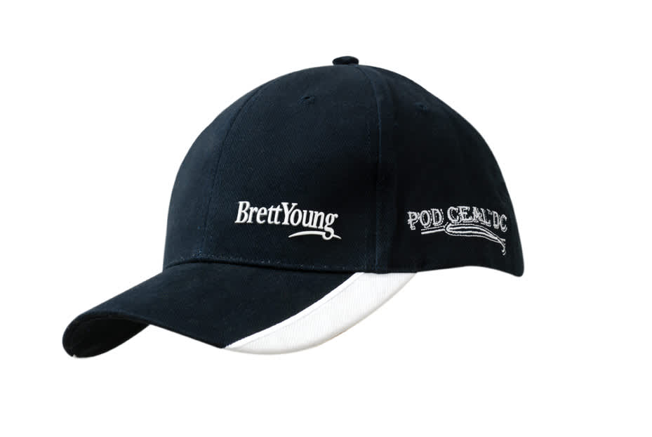 A navy brushed heavy cotton cap featuring peak indents and white embroidery, with a logo.