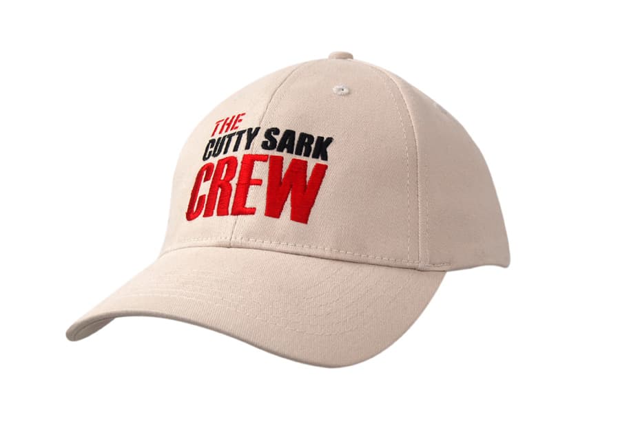 A beige cap made of heavy cotton and spandex, featuring an embroidered logo on the front.