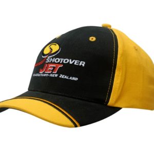 A black and yellow brushed heavy cotton cap with a peak indent and embroidery, featuring a logo.