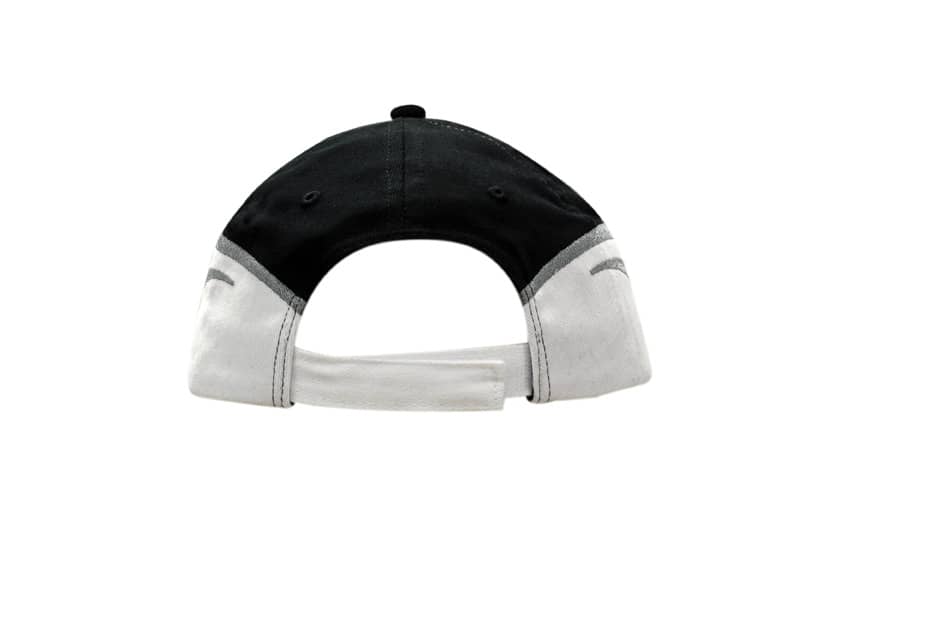 A black and white cap featuring fabric inserts and embroidery on the crown and peak, with an adjustable back strap.