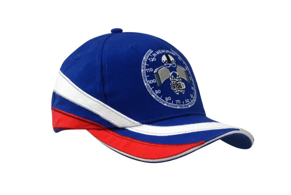 A blue cap with red and white fabric inserts, featuring embroidery on the crown and peak, and a logo.