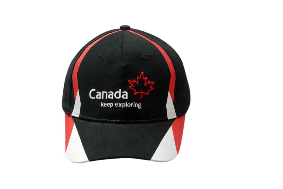 A black cap with red and white accents, featuring a logo and printed design.