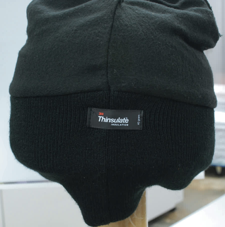 Acrylic beanie in black with a Thinsulate lining tag, featuring a snug, soft design.