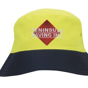A luminescent safety bucket hat in yellow and navy, featuring an embroidered logo on the front.