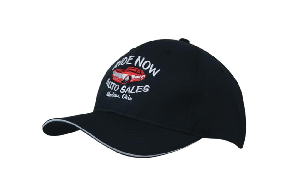 A black cap with a sandwich brim, featuring an embroidered logo on the front.