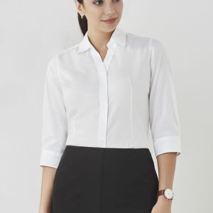 A white women's button-up shirt with 3/4 sleeves, styled with a collar and featuring a logo.